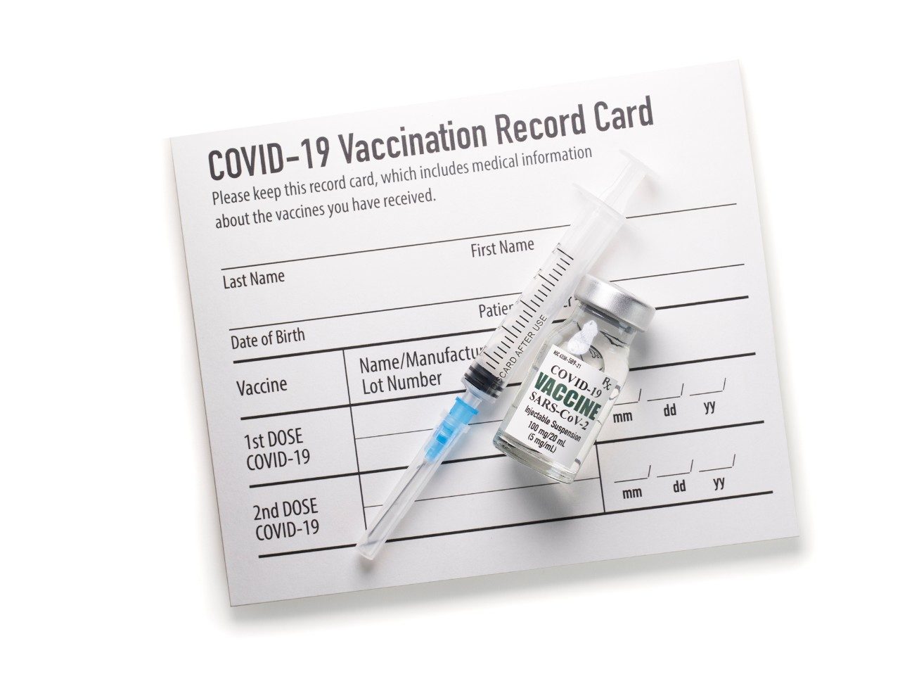 COVID-19 vaccination record card with syringe and vaccine vial