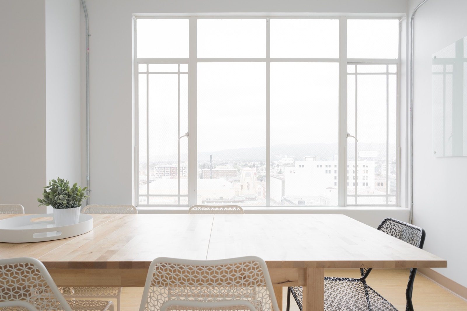 Bright office meeting room with a wooden table