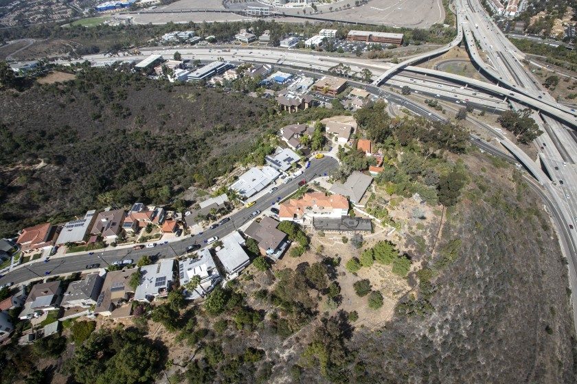 Aerial view of a California residential neighborhood near a freeway